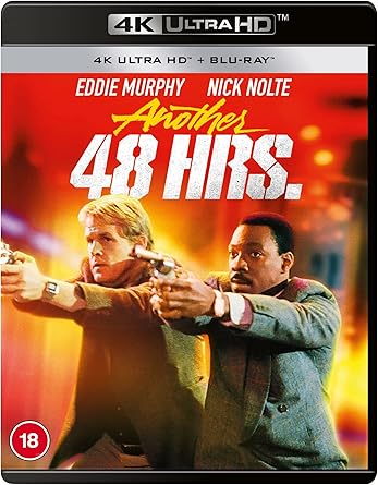 Blu-ray cover of 'Another 48 Hrs.' with two men pointing guns against a fiery background.