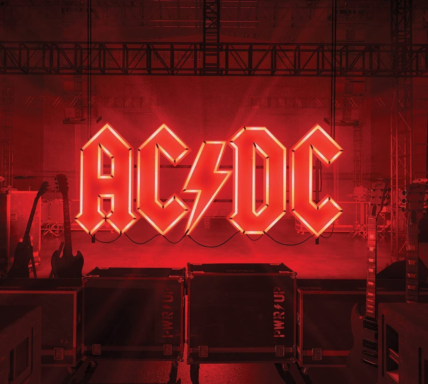 A CD case with the AC/DC logo in red and yellow on the cover, representing the album 'Power Up'.
