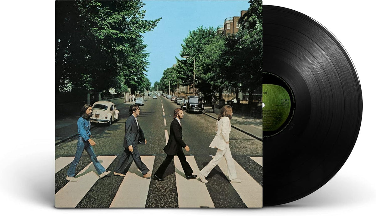 Vinyl record with cover showing four individuals crossing a zebra crossing, surrounded by trees and cars.