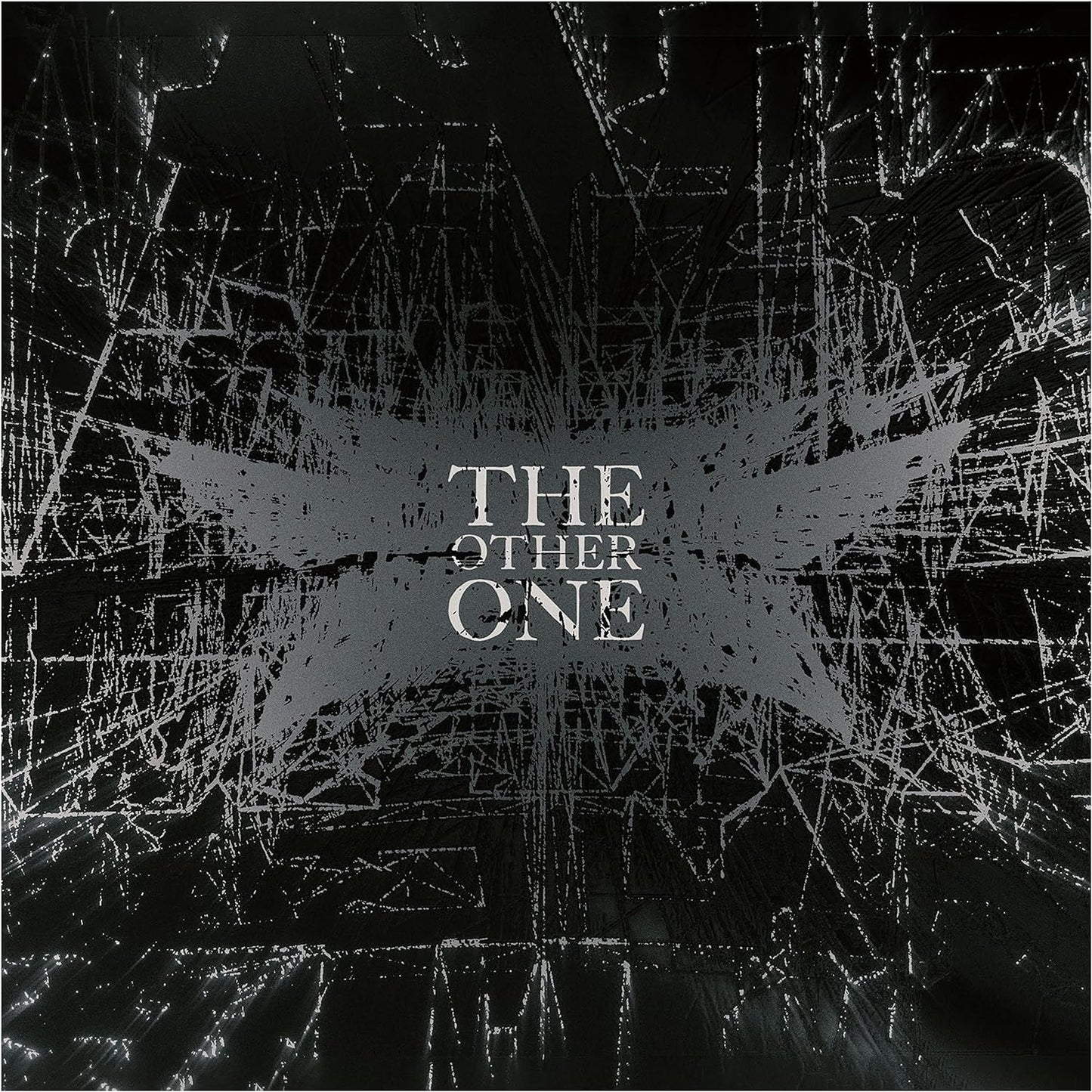 Audio CD cover art featuring a dark, distorted image with the text 'THE OTHER ONE' and a symbol resembling a bat or a similar creature, indicative of a heavy metal band.