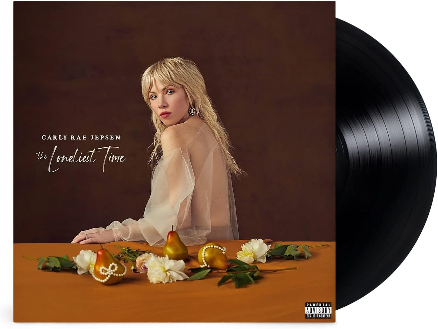 A vinyl record cover featuring Carly Rae Jepsen with the title 'The Loneliest Time' on it. The cover has a warm color palette and shows a stylized photograph of Carly Rae Jepsen alongside a table set with flowers and fruit.