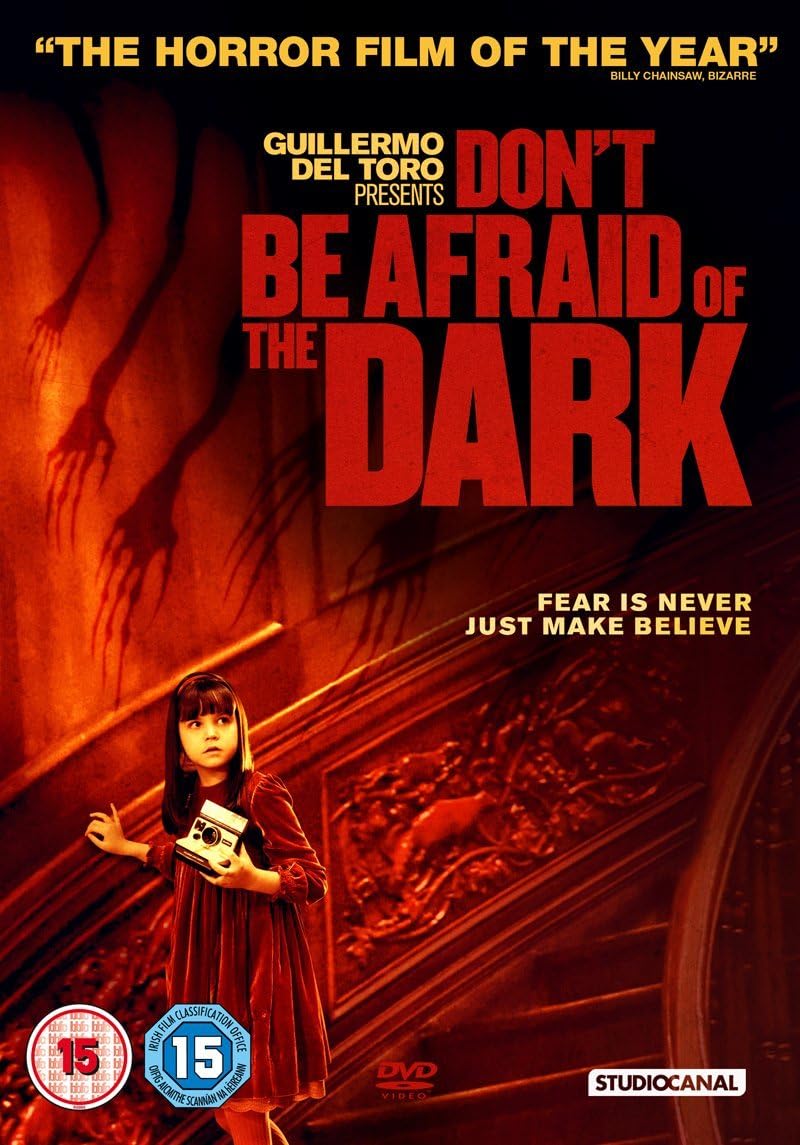 Movie poster for 'Don't Be Afraid of the Dark' with a child holding a radio and a shadowy figure.