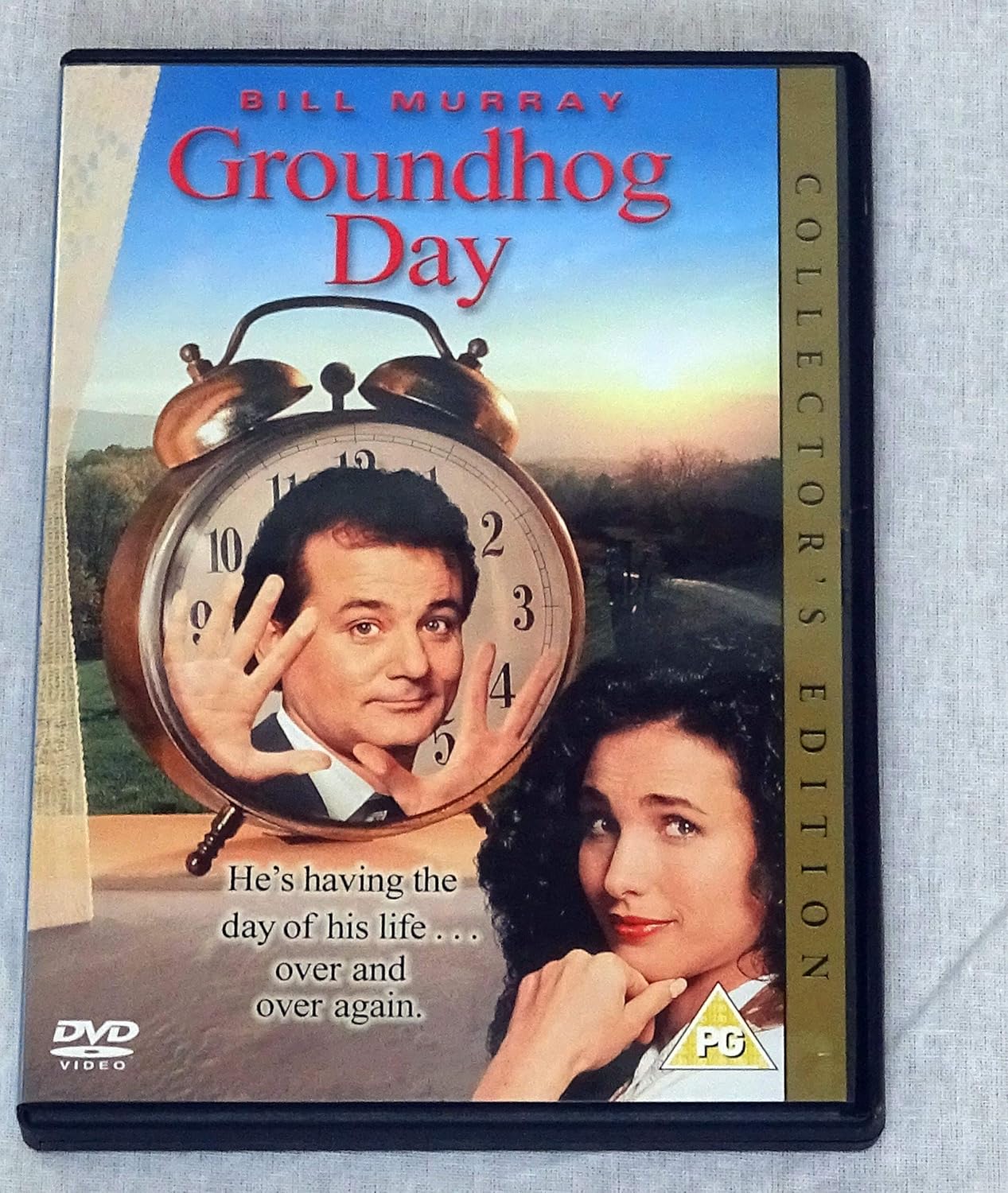 DVD cover of 'Groundhog Day' with Bill Murray and a clock