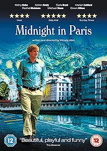 Movie poster for 'Midnight in Paris' with a man walking along a Parisian street.