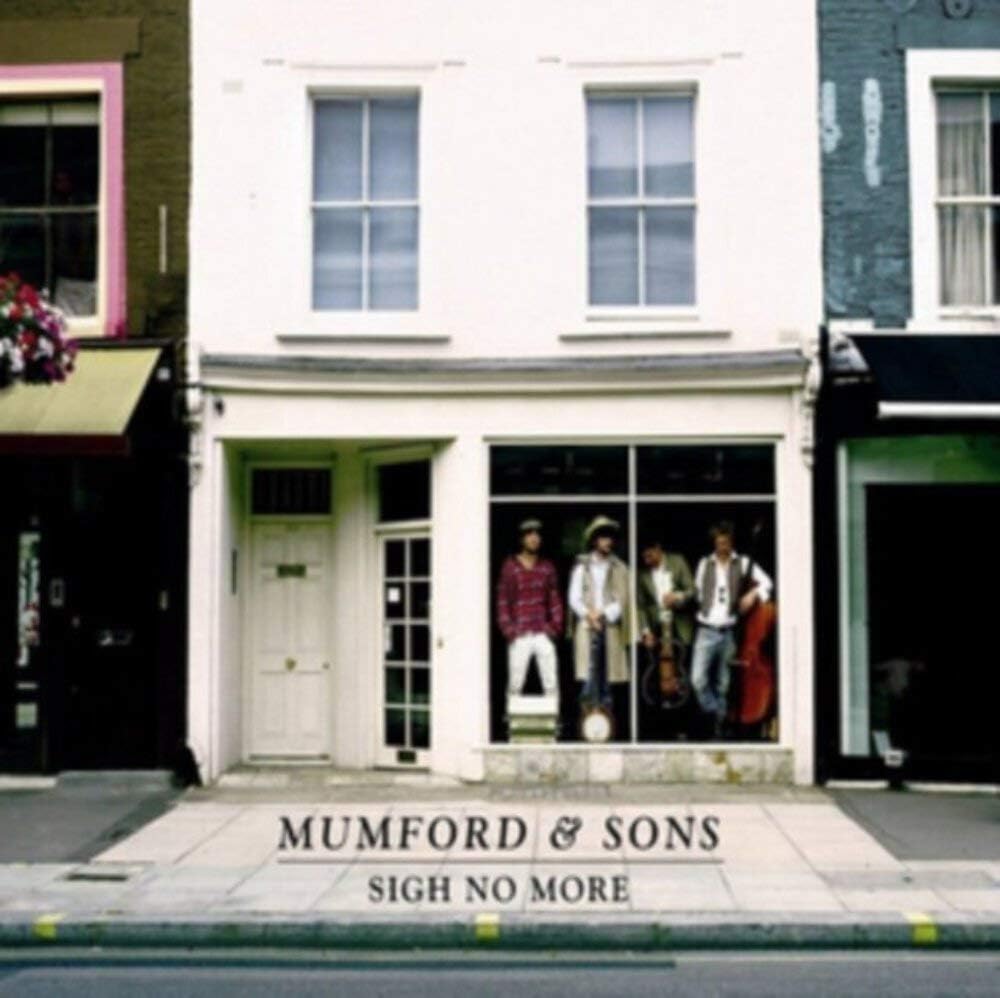 Mumford & Sons Sigh No More album cover featuring the band members on the sidewalk outside a storefront.