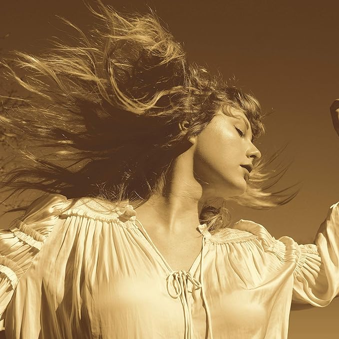 A CD cover featuring a close-up image of a woman with flowing blonde hair, dressed in a white top, performing a song.