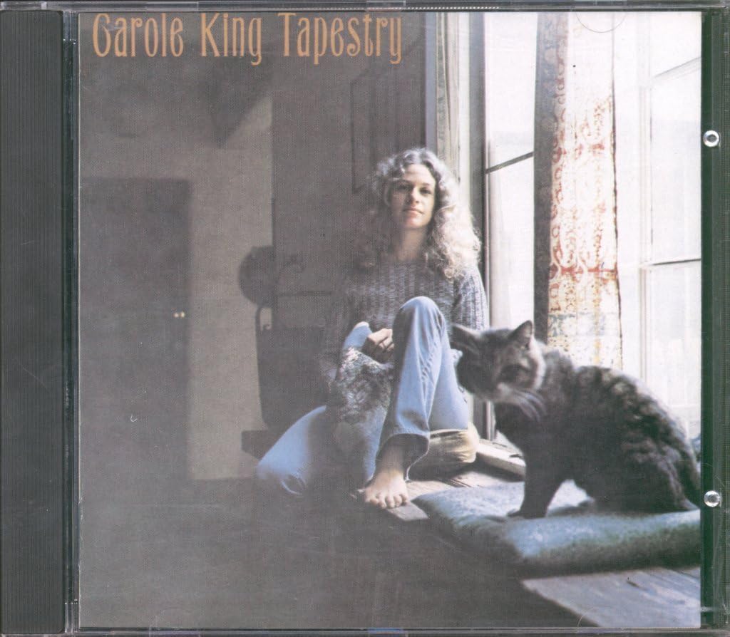 Album cover of 'Tapestry' by Carole King featuring a woman with cats.