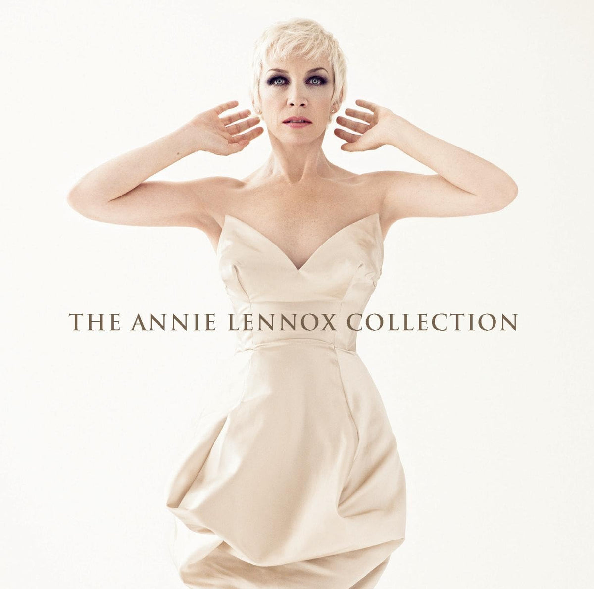 Album cover for 'The Annie Lennox Collection' featuring a woman in a white dress.