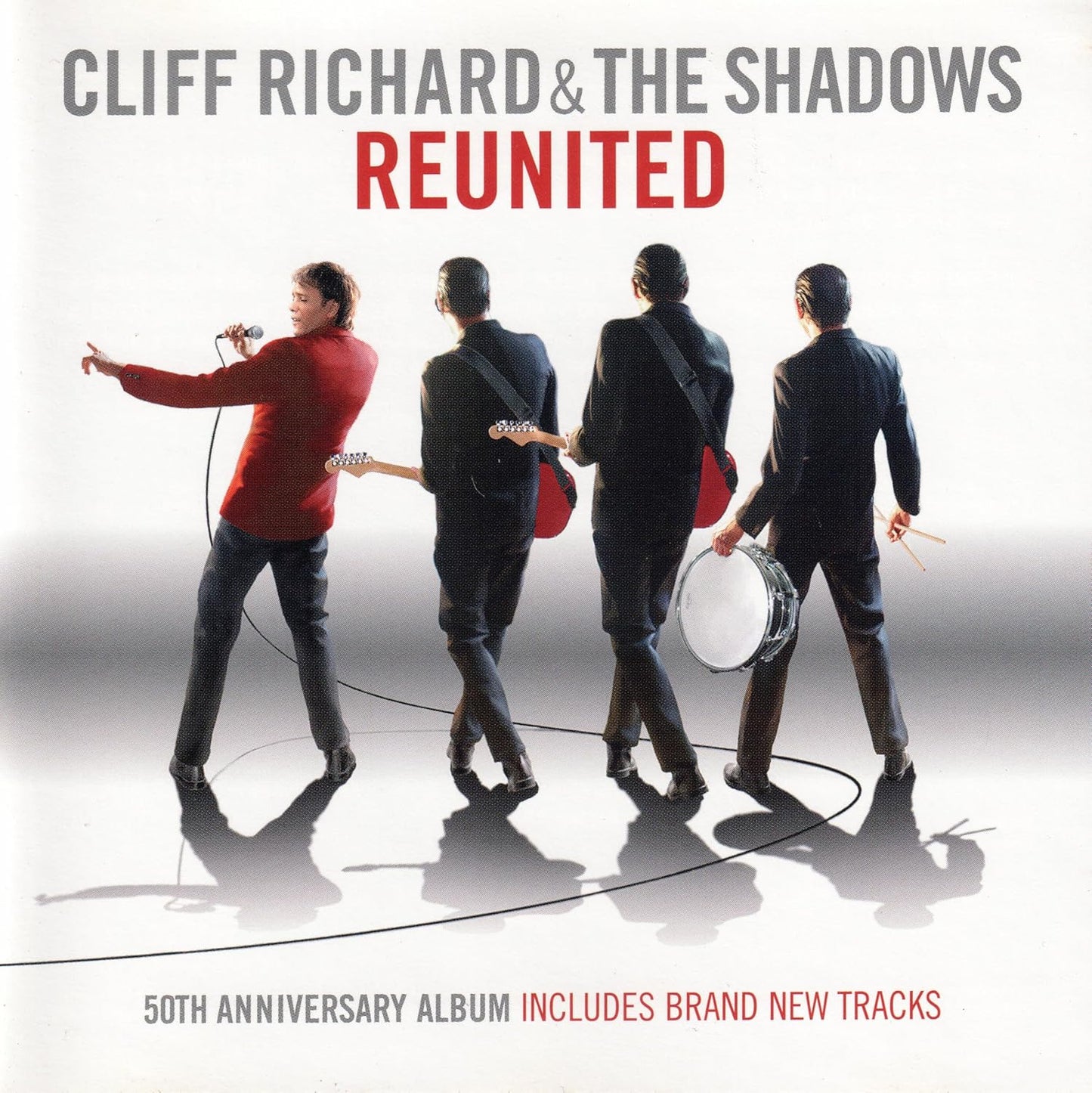 Album cover for 'Cliff Richard & The Shadows Reunited' with four band members holding instruments on a white background.