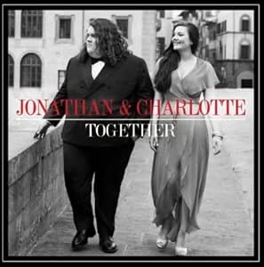 Black and white photo of a man and woman walking together with 'Jonathan & Charlotte Together' text overlay.