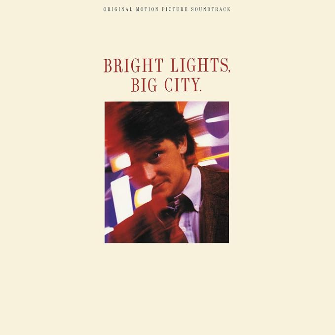 Album cover for 'Bright Lights, Big City' with a portrait of a man on a beige background.