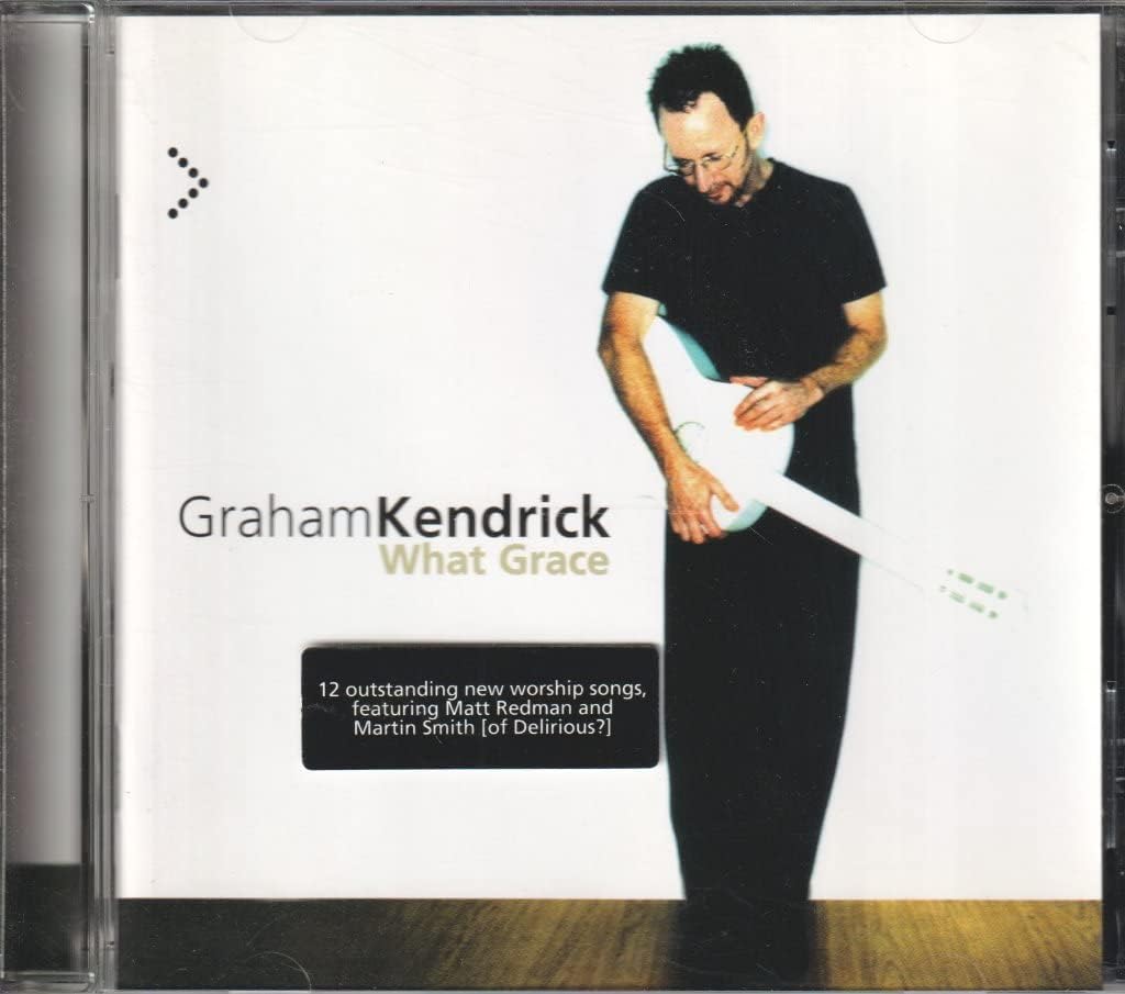 CD cover of 'What Grace' by Graham Kendrick featuring a person holding a guitar.