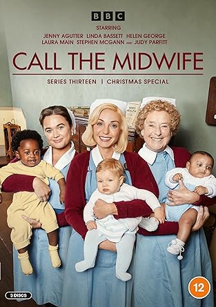 DVD cover for 'Call The Midwife: Series 13' featuring a group photograph of the main characters from the series, with a Christmas theme indicated by the presence of a Christmas tree in the background.