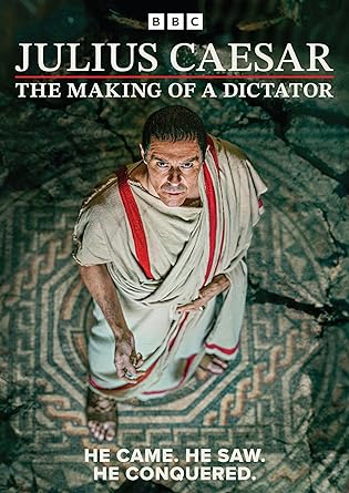 DVD cover featuring a man in ancient Roman attire, likely to represent Julius Caesar, standing in a public square, foreshadowing the theme of power and leadership.