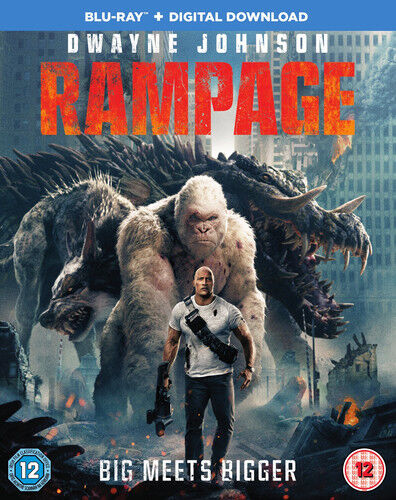 The cover image features a man with a gun, likely the protagonist, in a dynamic pose with a backdrop of two large, fierce-looking animals in a ruined cityscape, suggesting a scene of action or adventure from the movie 'Rampage'.