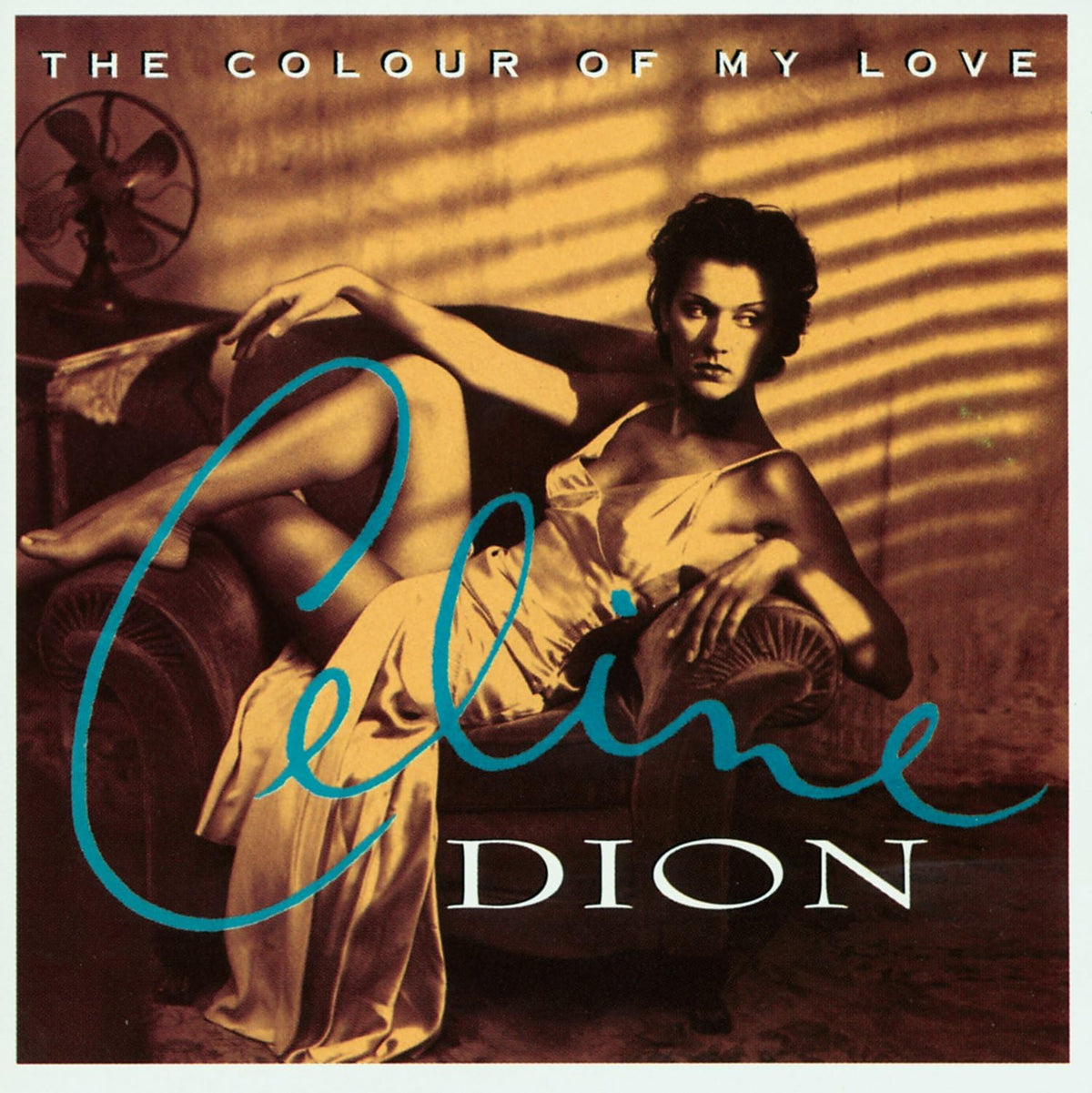 Album cover featuring a woman sitting on a couch with text 'The Colour of My Love' and 'Celine Dion'.