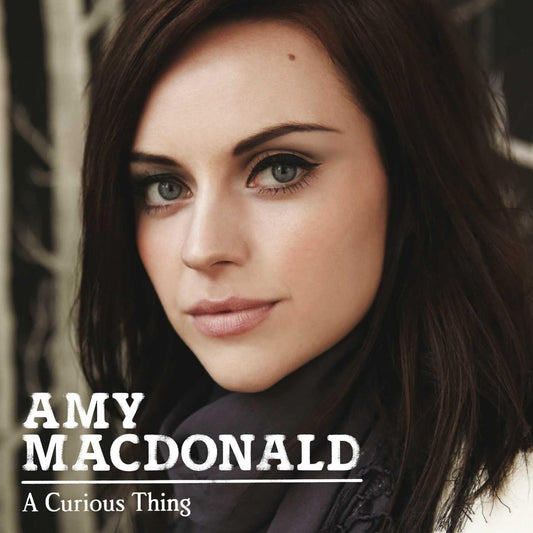 Album cover with a woman's face and 'Amy Macdonald A Curious Thing' text
