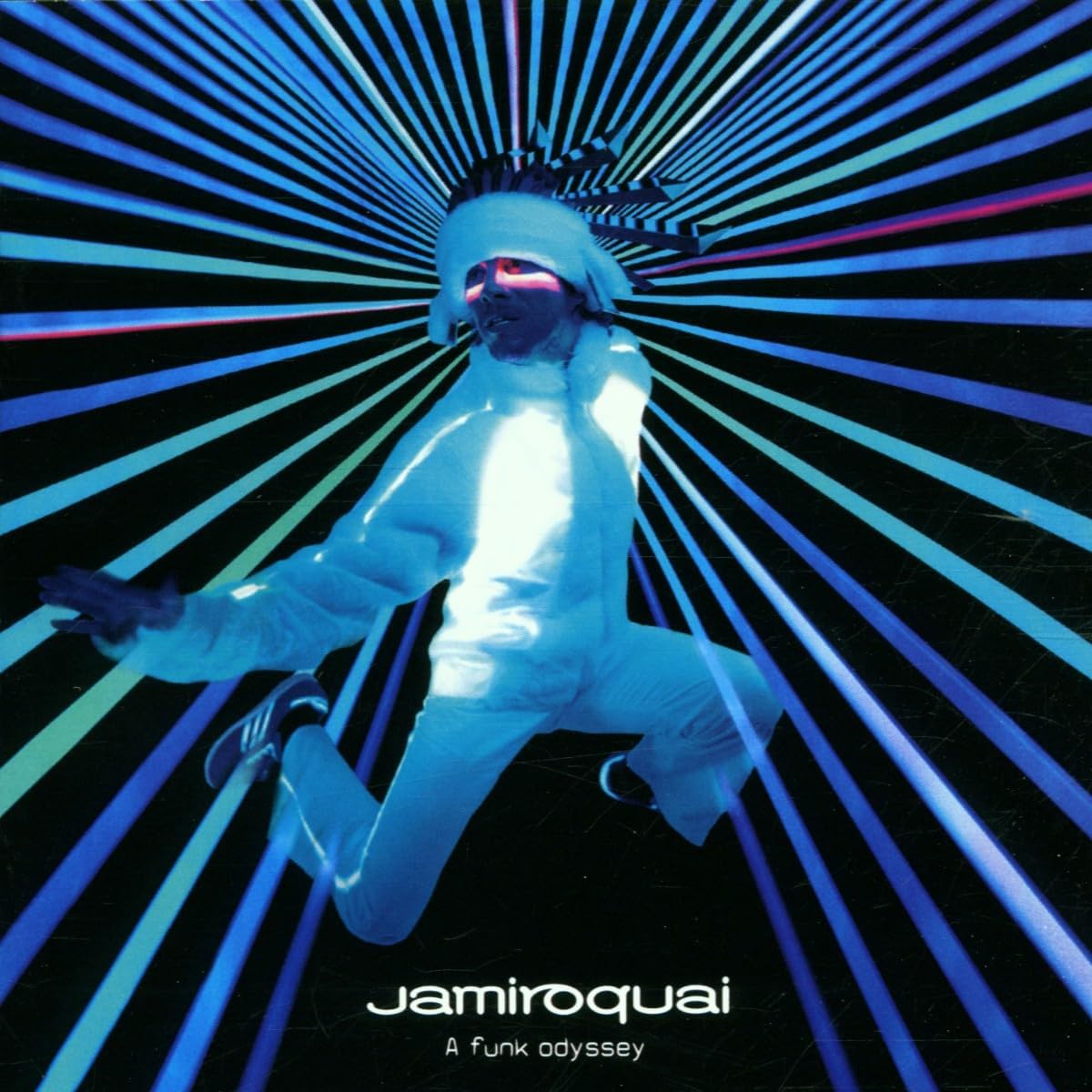 Album cover with a person in a white outfit and sunglasses against a vibrant, abstract background with the text 'jamiroquai' and 'A funk odyssey'.