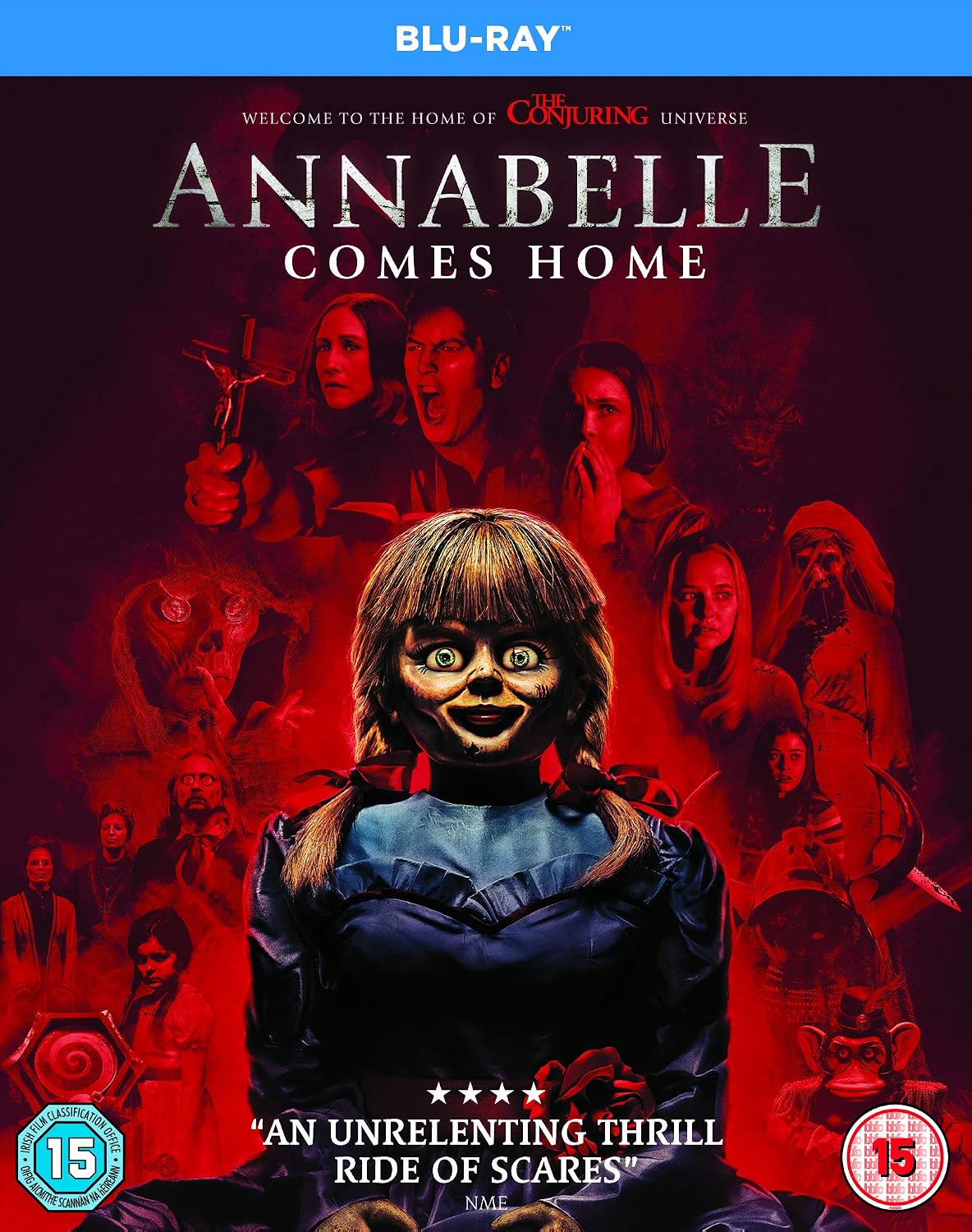 Blu-ray cover for 'Annabelle Comes Home' from The Conjuring Universe, featuring a dark red and black horror-themed collage with the Annabelle doll centered, a blue top banner reading BLU-RAY, and age rating icons in the corners.