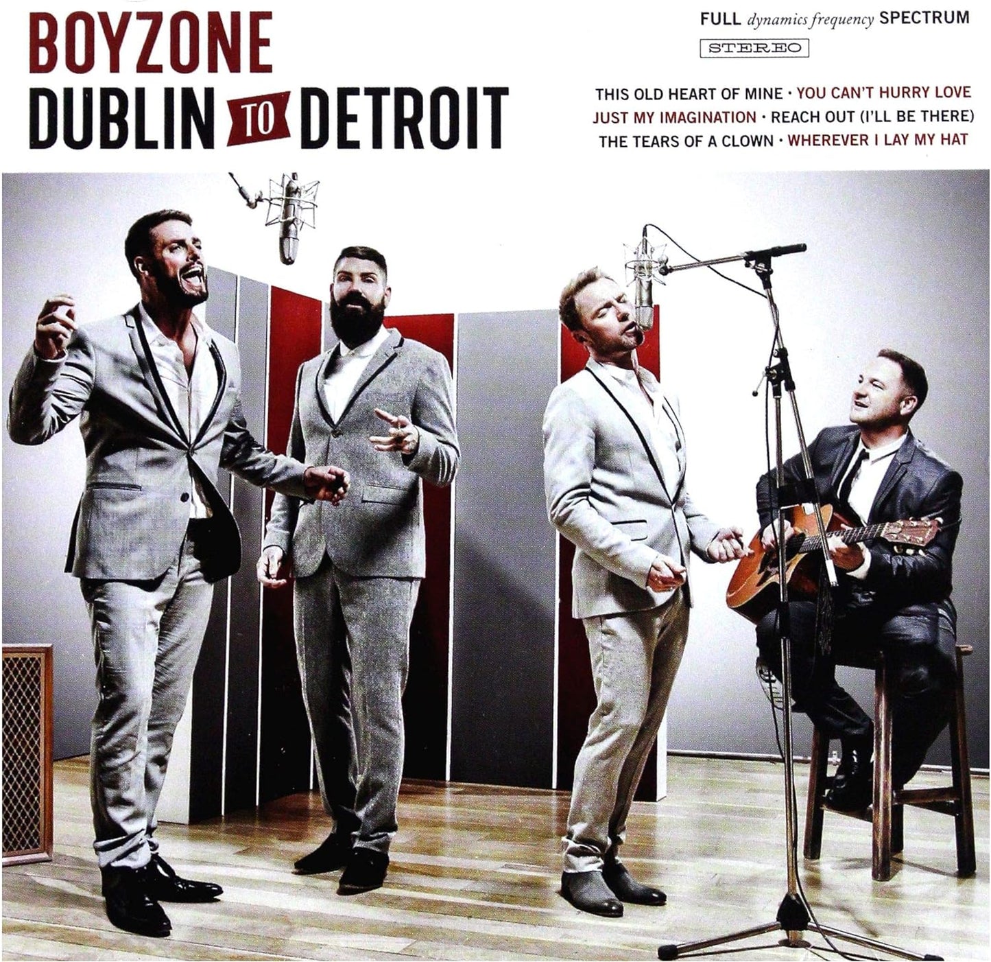 The cover image shows three members of the band Boyzone, dressed in business attire, with one member holding a guitar, singing a song in front of a microphone.