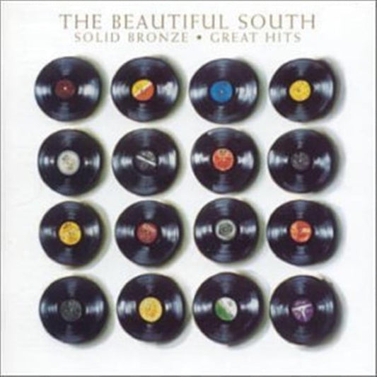 Album cover for 'The Beautiful South - Solid Bronze • Great Hits' featuring a grid of 12 black vinyl records with various colored labels on a white background.