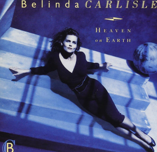 A CD cover featuring the artist Belinda Carlisle with 'Heaven On Earth' title, a shadow of a globe, and the Virgin Records logo.