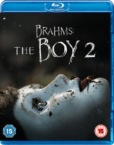 Blu-ray cover for the movie 'Brahms: The Boy 2' featuring a close-up of a person's face with dirt and insects, set against a dark background.