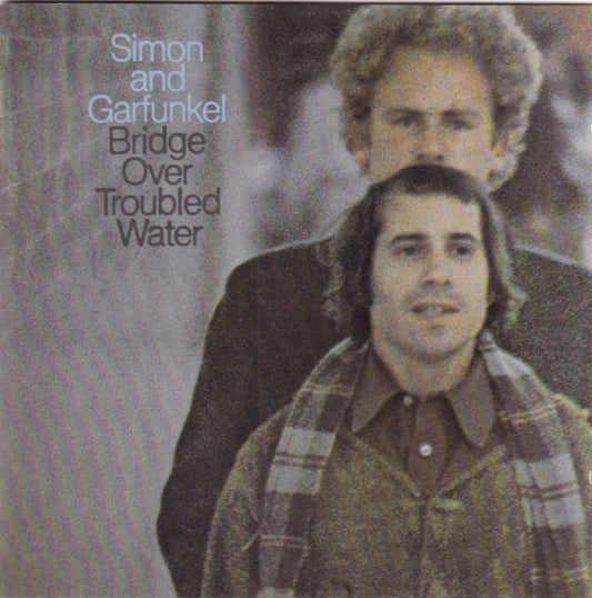 Album cover of 'Bridge Over Troubled Water' by Simon and Garfunkel with two individuals and a textured background.