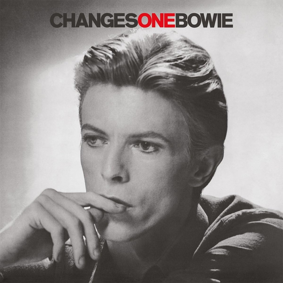 Album cover for David Bowie's 'Changes One Bowie' featuring a black and white portrait of the artist with the title text at the top, where 'ONE' is highlighted in red.