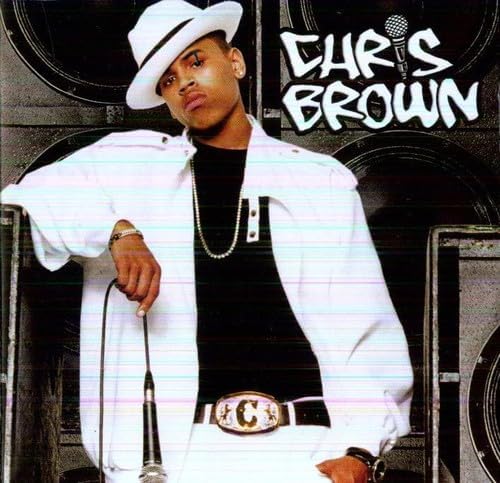 Person wearing a white hat and jacket with 'Chris Brown' text on a black background