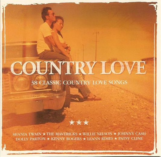 Album cover for 'Country Love: 38 Classic Country Love Songs' featuring a vintage orange-toned photo of a couple sitting on the front of a car, with large white title text and artist names listed at the bottom.