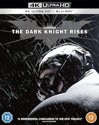 Blu-ray cover of 'The Dark Knight Rises' with superhero in mask against dark background