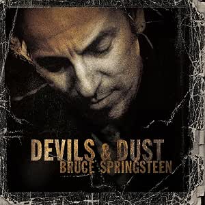 Album cover for 'Devils & Dust' by Bruce Springsteen, featuring a close-up portrait of the artist in dark, gritty tones with distressed border effects and gold-toned title text.