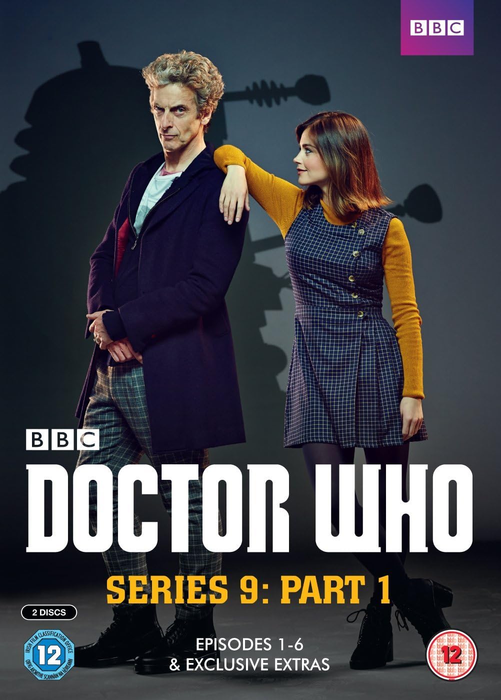 BBC Doctor Who Series 9 Part 1 DVD cover featuring Peter Capaldi and Karen Gillan standing in front of a dark silhouette of the TARDIS, with large white and yellow title text and age rating badges.