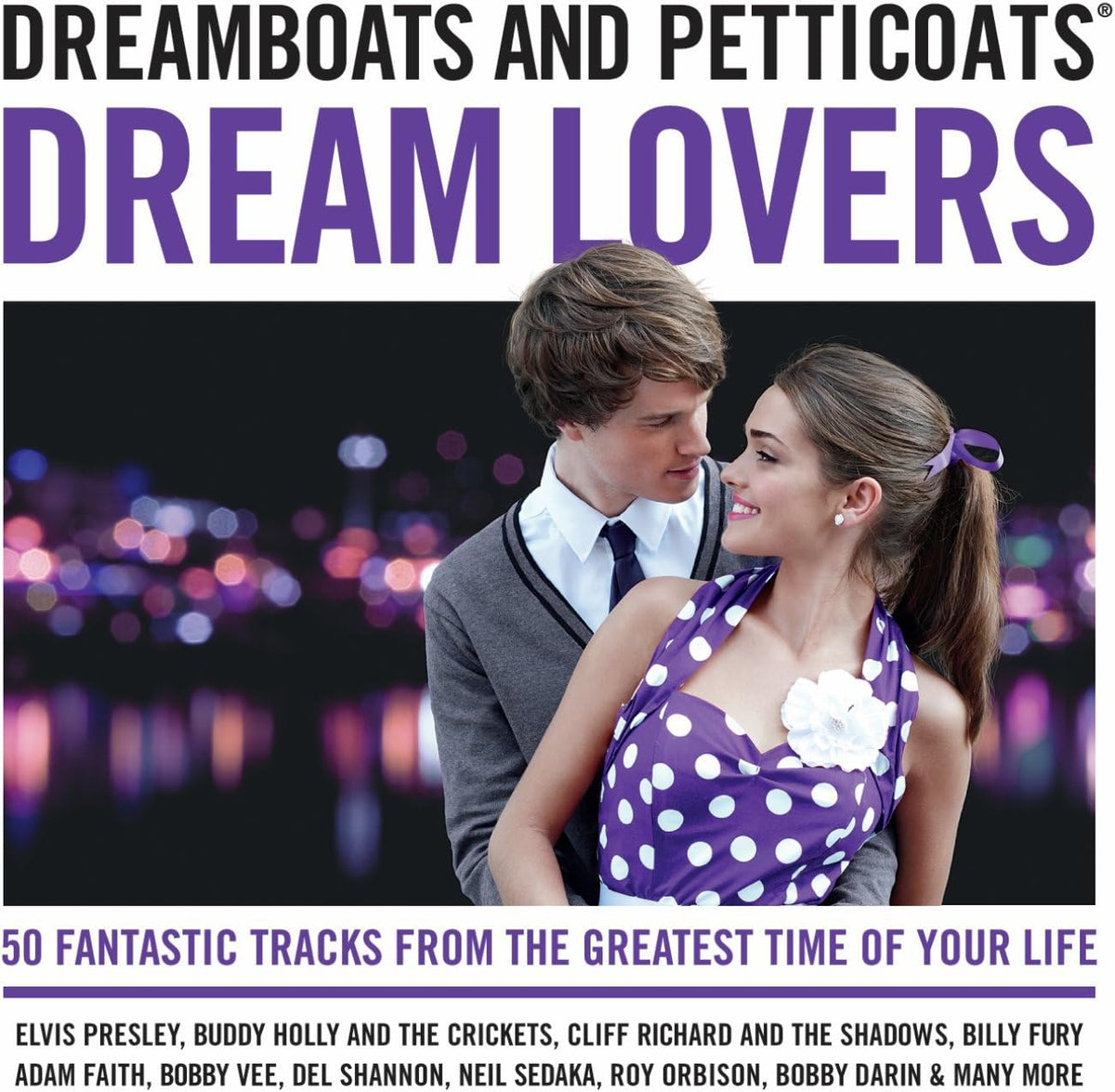 Album cover for 'Dream Lovers' by Dreamboats and Petticoats, featuring a couple embracing against a blurred city lights background. The top displays the artist names in black and purple text, and the bottom includes track listing text.