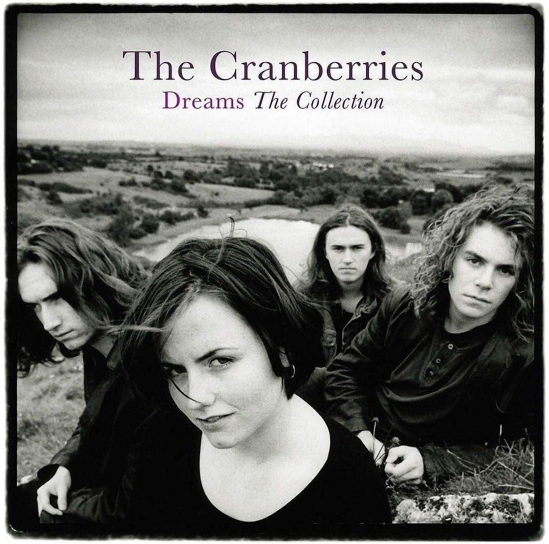 Album cover for 'Dreams The Collection' by The Cranberries featuring four band members in a field.