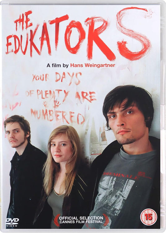 DVD cover for the film 'The Educators' starring Hans Weingartner, featuring three young men against a white background with red graffiti-style text. Includes a DVD logo, Cannes Film Festival selection badge, and a 15 rating mark.