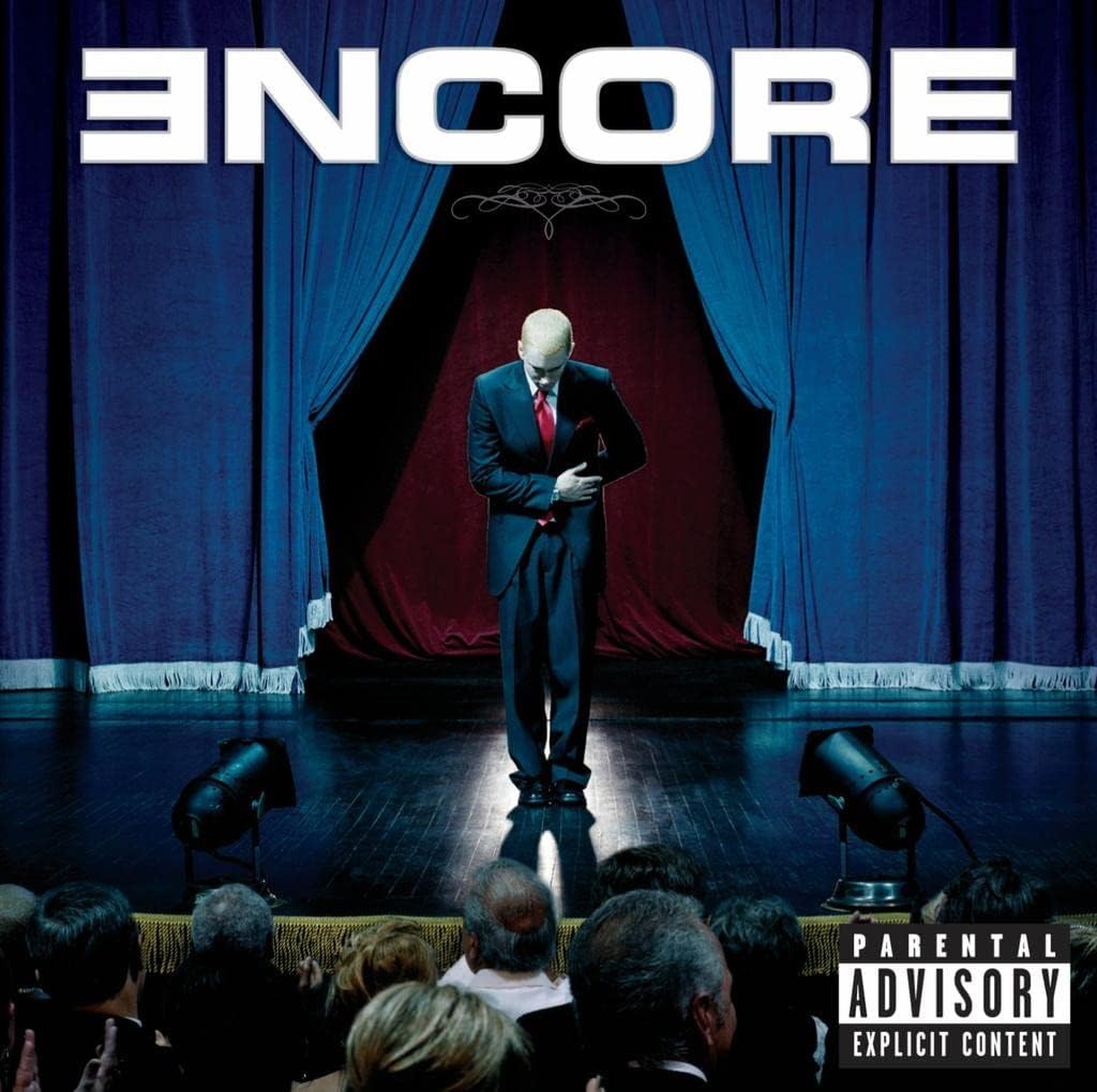 Album cover with a person on stage in front of an audience, featuring the word 'Encore' and a parental advisory label.