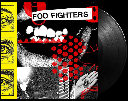 Vinyl record with Foo Fighters album cover featuring a mouth and eyes design.