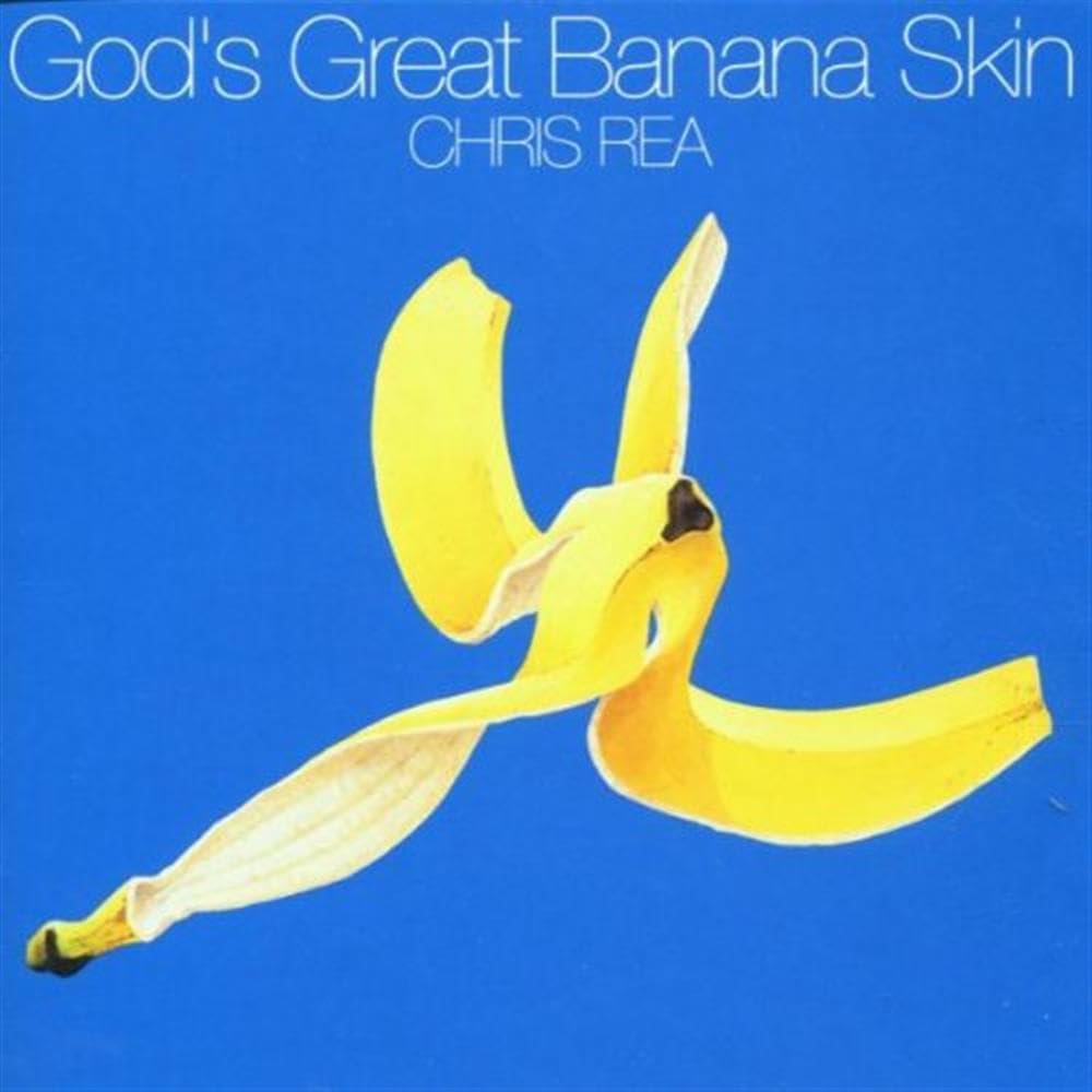 Album cover for Chris Rea's 'God's Great Banana Skin' featuring a yellow banana peel curled into a spiral shape against a solid blue background, with the title and artist name in white text at the top.