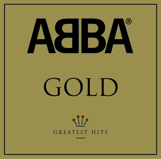 Square cover art for ABBA's 'Gold: Greatest Hits' featuring the band name in large black letters, the word 'GOLD' in serif type, and a small crown graphic above 'GREATEST HITS' on an olive-gold background.