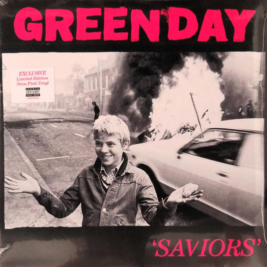 Album cover for Green Day's 'Saviors' with a black and white photo of a boy by a burning car.