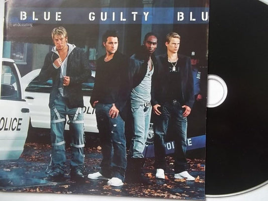 Blue Guilty Blu-3CD album set with the printed cover on the left and a black CD disc partially visible on the right against a white background.