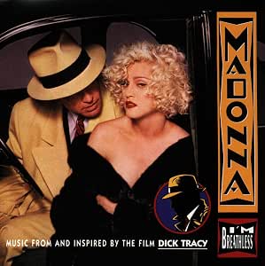 Album cover for 'Madonna: Music from and Inspired by the Film Dick Tracy', featuring a blonde woman in a black dress and a man in a beige suit and fedora seated in a car, with the title text and 'I'm Yours' logo.