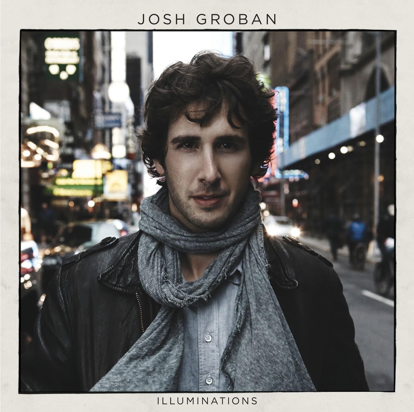 Album cover with a person wearing a scarf on a city street, featuring the name 'Josh Groban' and album title 'Illuminations'.