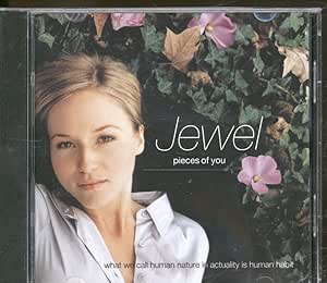 Jewel's 'Pieces of You' album cover featuring the artist with a backdrop of greenery, reflecting a serene and artistic vibe.