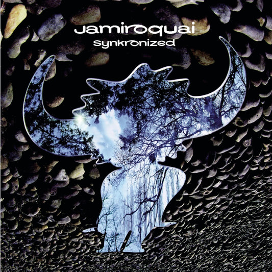 Album cover with 'jamiroquai' and 'synkronized' text, featuring a stylized moon and tree design on a pebble background.