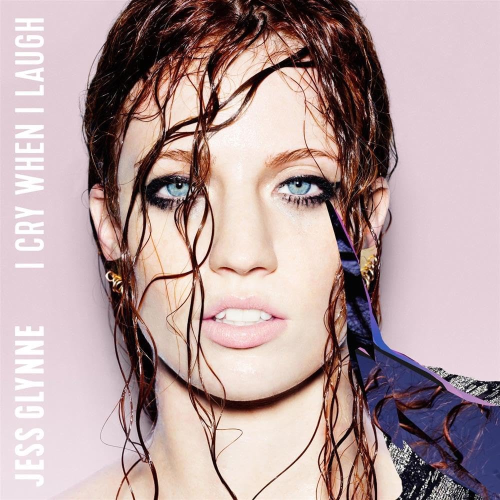 Album cover with a person with wet hair against a pink background