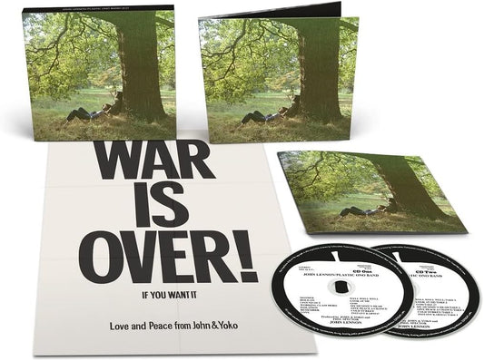Vinyl record set with 'War is Over!' cover and two CDs on a white background