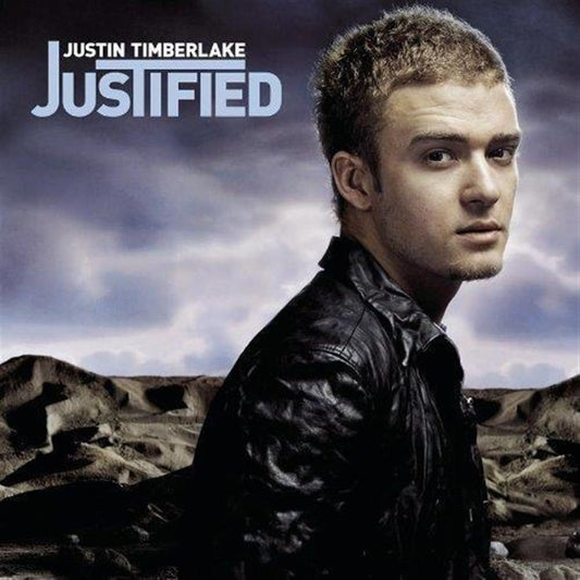 Album cover with a person wearing a leather jacket against a rocky landscape with 'Justified' text.